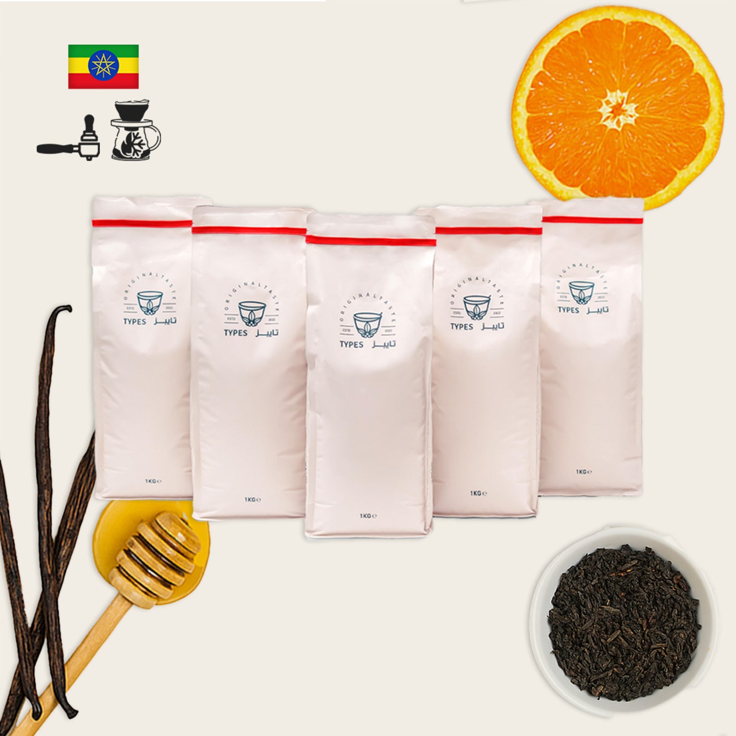 coffee packages with an orange slice, vanilla beans, and a bowl of tea leaves on a white background.