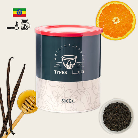 Coffee canister with vanilla beans, honey, and orange on a white background